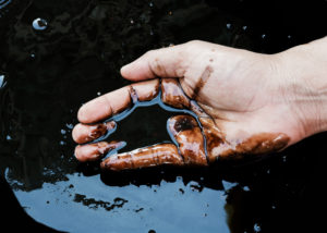 hands in oil